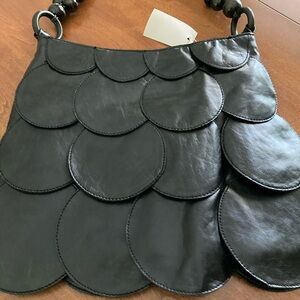Very nice handbag. Black in color.